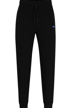 Jogginghose aus Baumwoll-Terry mit blauem Logo-Aufnäher